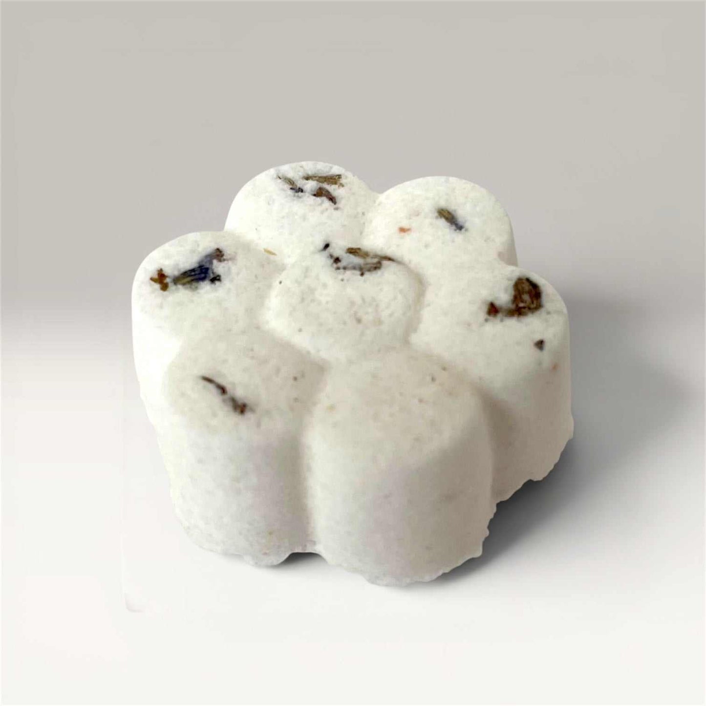 Relaxing lavender magnesium bath bomb fizzing with Himalayan salt and botanicals