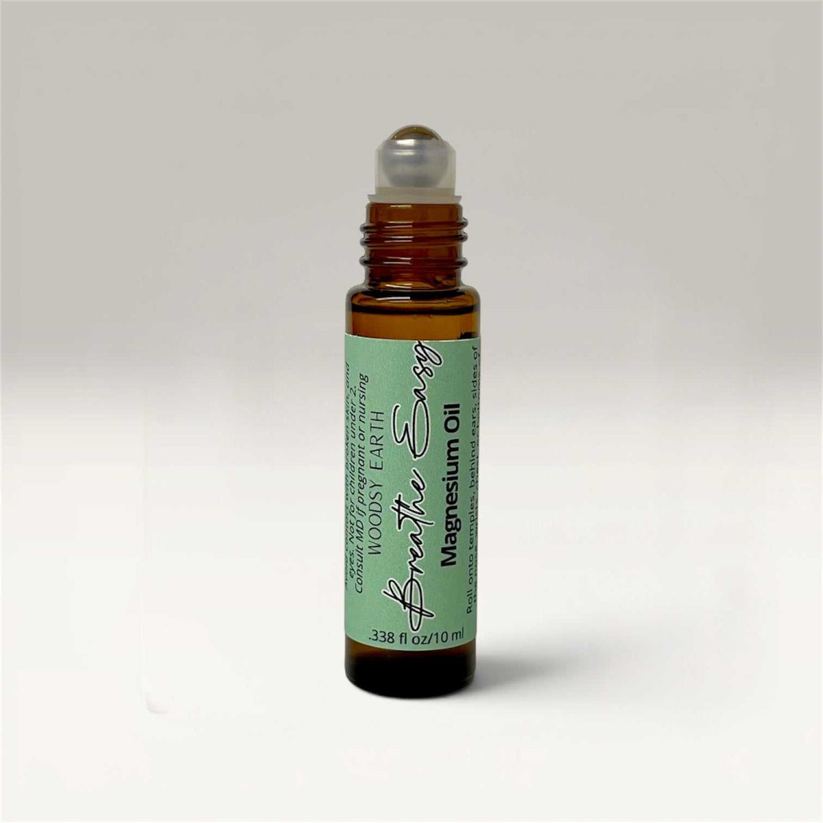 Set of three 10ml magnesium oil roll-on bottles labeled Calm Mind, Deep Sleep, and Breathe Easy for targeted topical application.