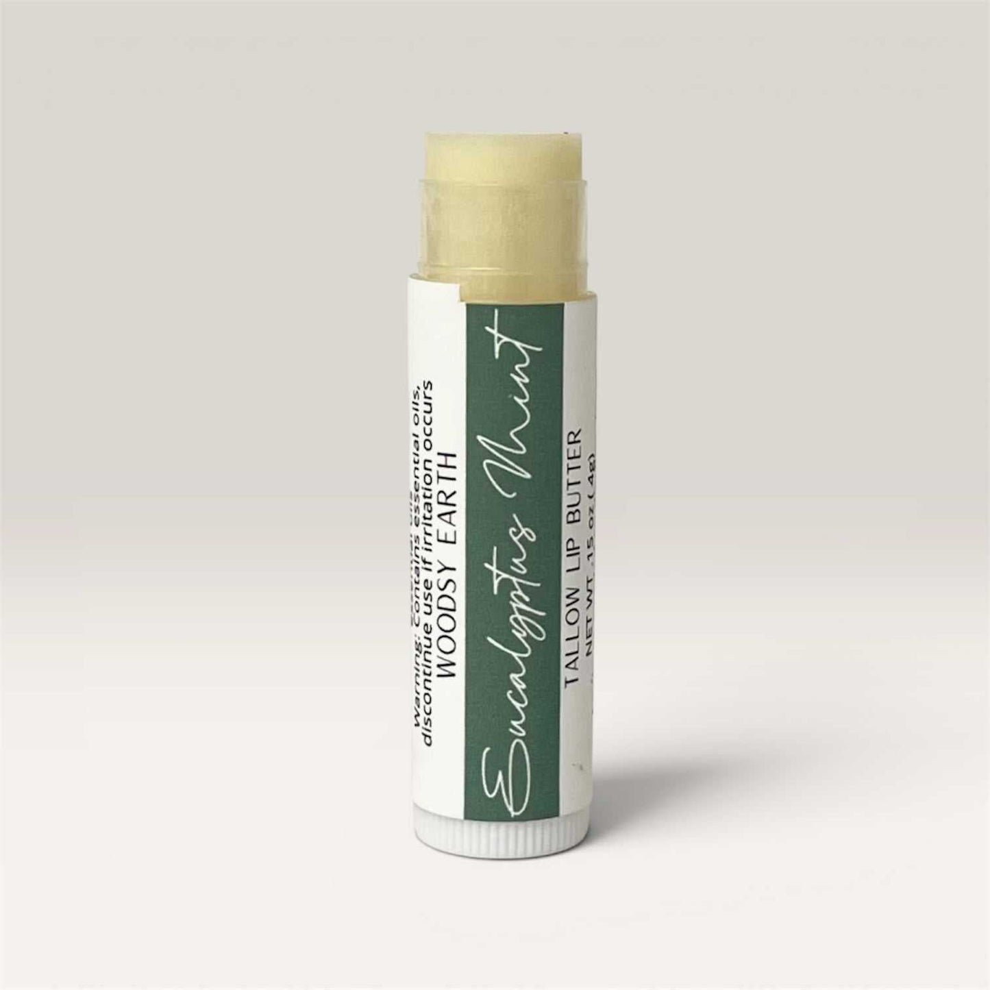 Tube of Eucalyptus Spearmint Tallow Lip Butter with creamy texture and natural oils for moisturizing lips