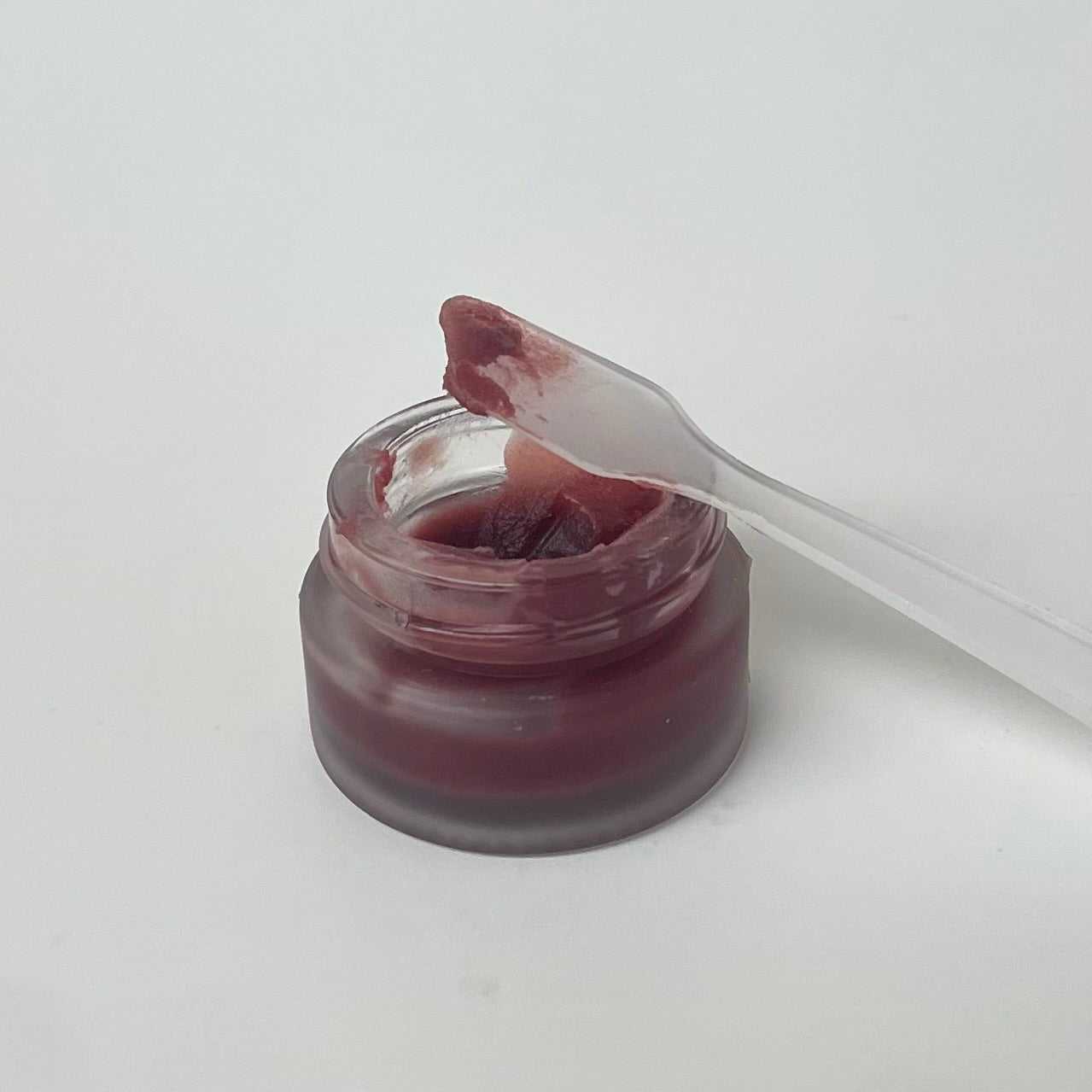 Tinted Tallow Lip Gloss in glass jar with natural soft rose-berry color and glossy shine