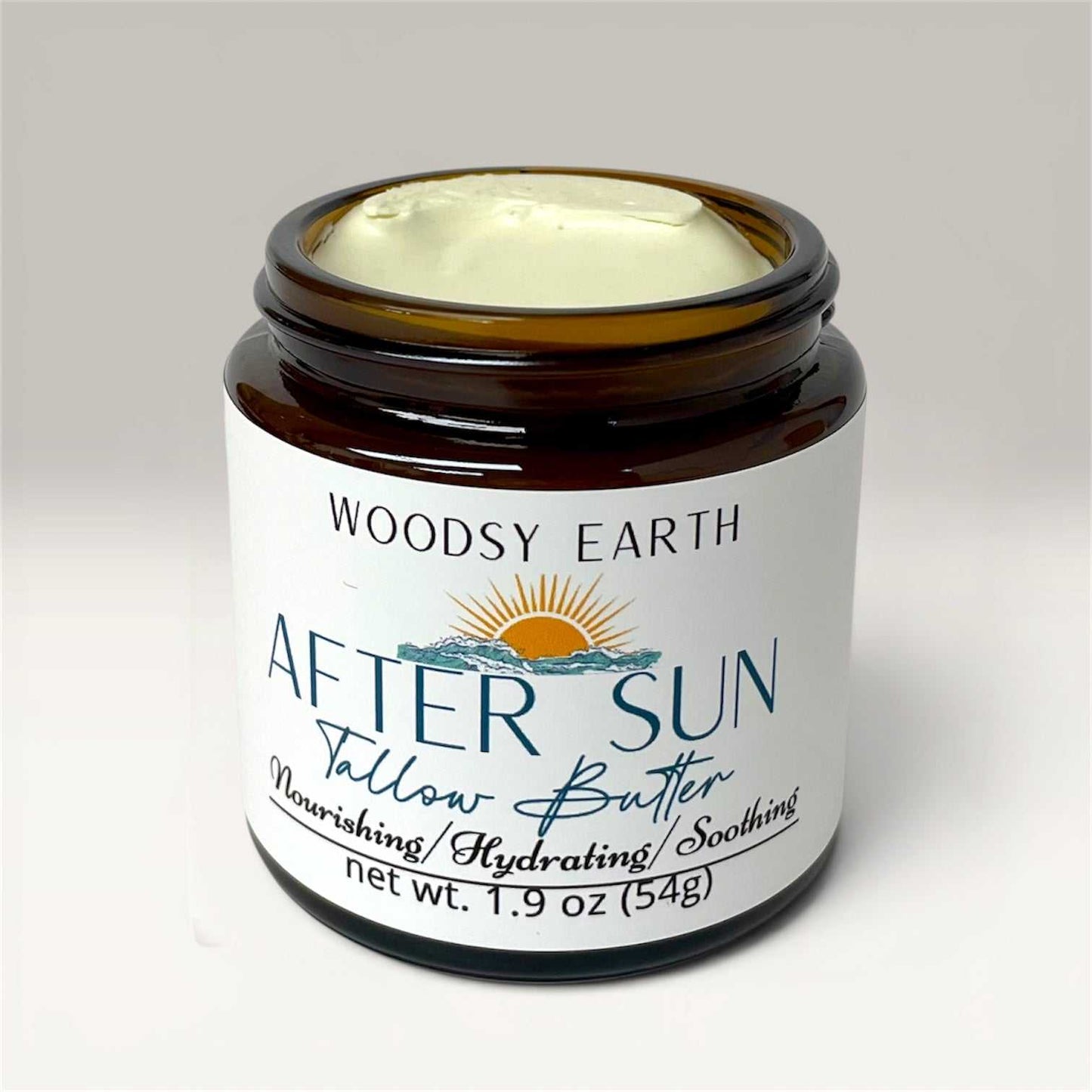 Jar of After Sun Tallow Herbal Recovery Butter with natural ingredients for soothing sun-kissed skin