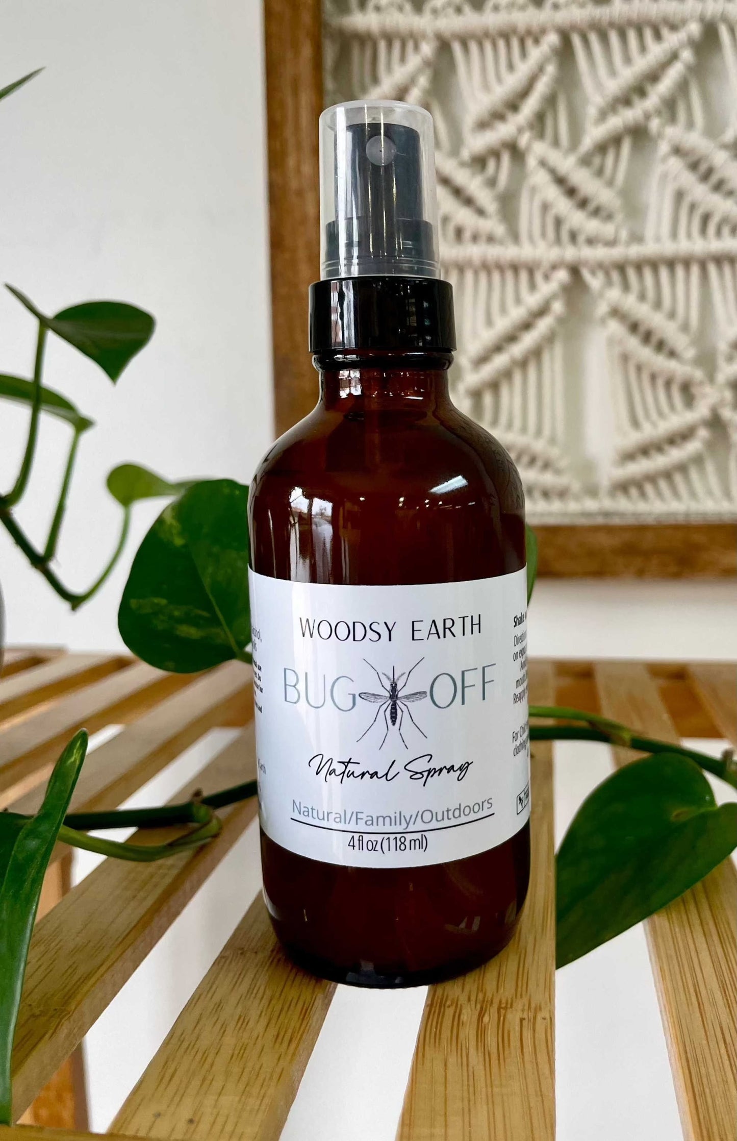 Woodsy Earth Bug Off Natural Spray in amber bottle, non-toxic bug repellent safe for kids and family outdoor protection
