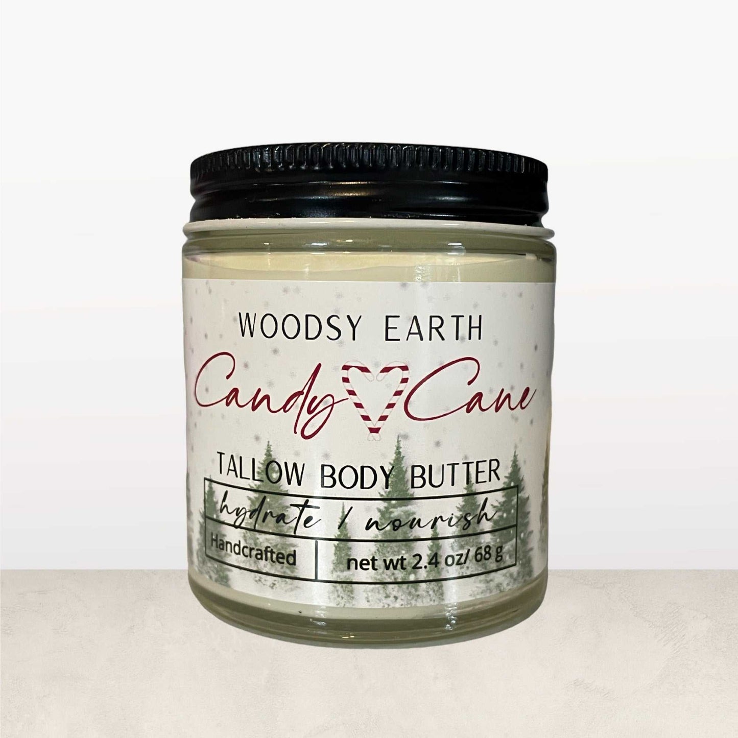 Candy Cane Tallow Body Butter in glass jar with black lid, moisturizing holiday skincare with peppermint, spearmint, and vanilla for soft, nourished skin.