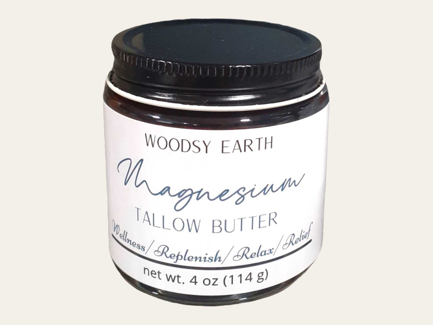 Woodsy Earth Magnesium Tallow Butter in amber jar, infused with rosemary and St. John’s Wort for relaxation, replenishment, and natural relief