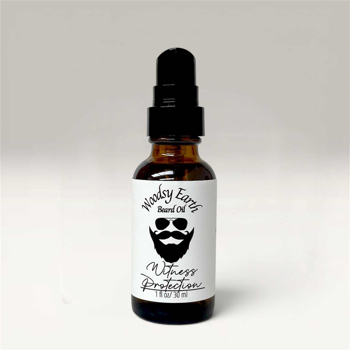 Beard oil bottle with natural botanical ingredients for softening and conditioning beard hair and skin