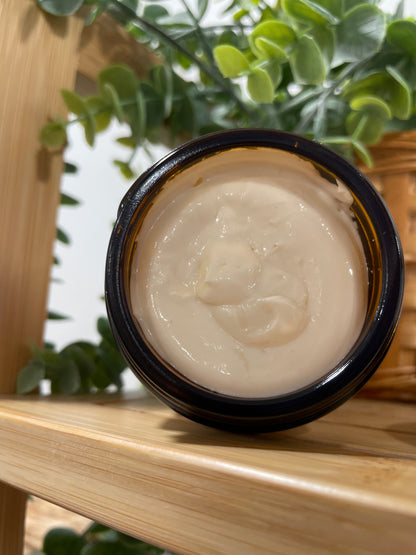 Vanilla Body Butter in glass jar with moisturizing whipped texture.