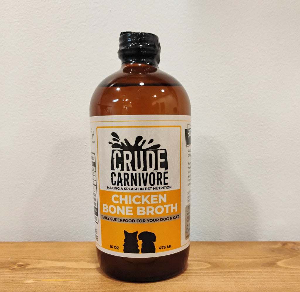 Crude Carnivore Chicken Bone Broth in 16 oz bottle for pets.