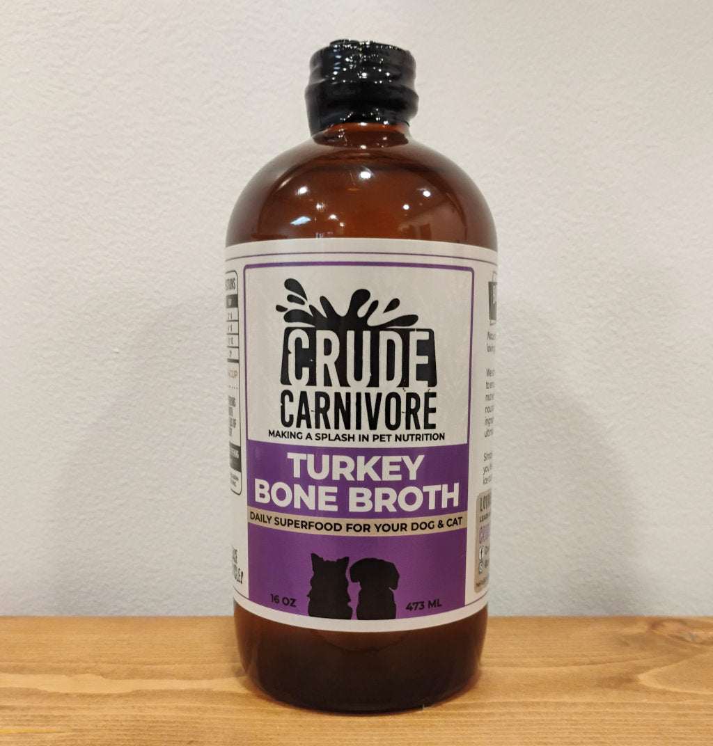 Crude Carnivore Turkey Bone Broth bottle for dogs and cats with sensitive stomachs.