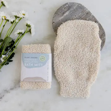 Woodsy Earth Jute Bath Shower Mitt displayed on a wooden surface, highlighting its natural fibers