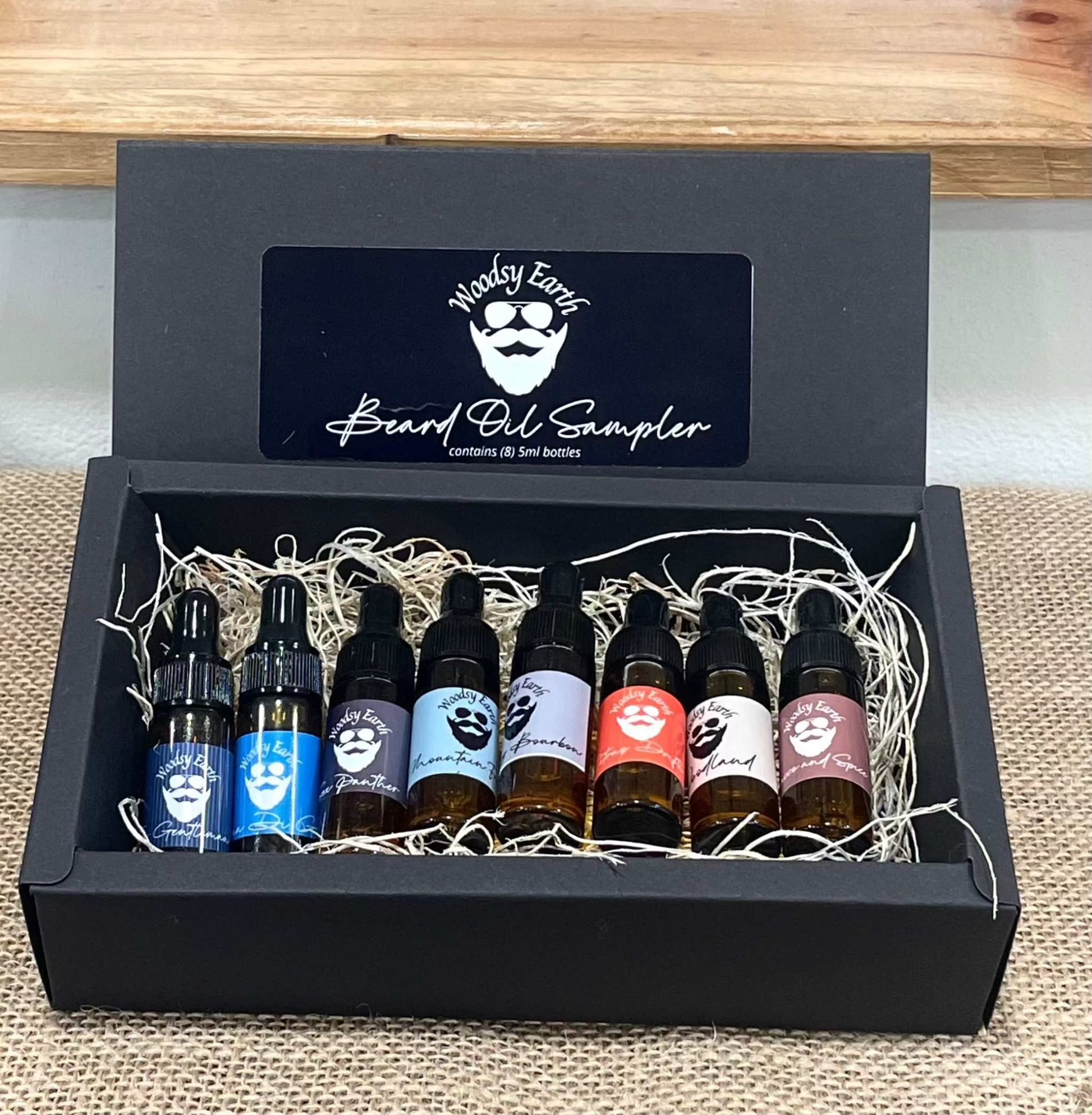 Beard Oil Sampler set with eight 5ml dropper bottles showcasing diverse scents.