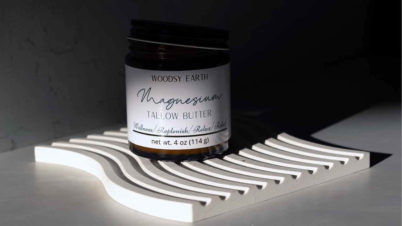 Woodsy Earth Pain Relieving Body Butter with key ingredients displayed, emphasizing its magnesium-infused formula for natural pain relief