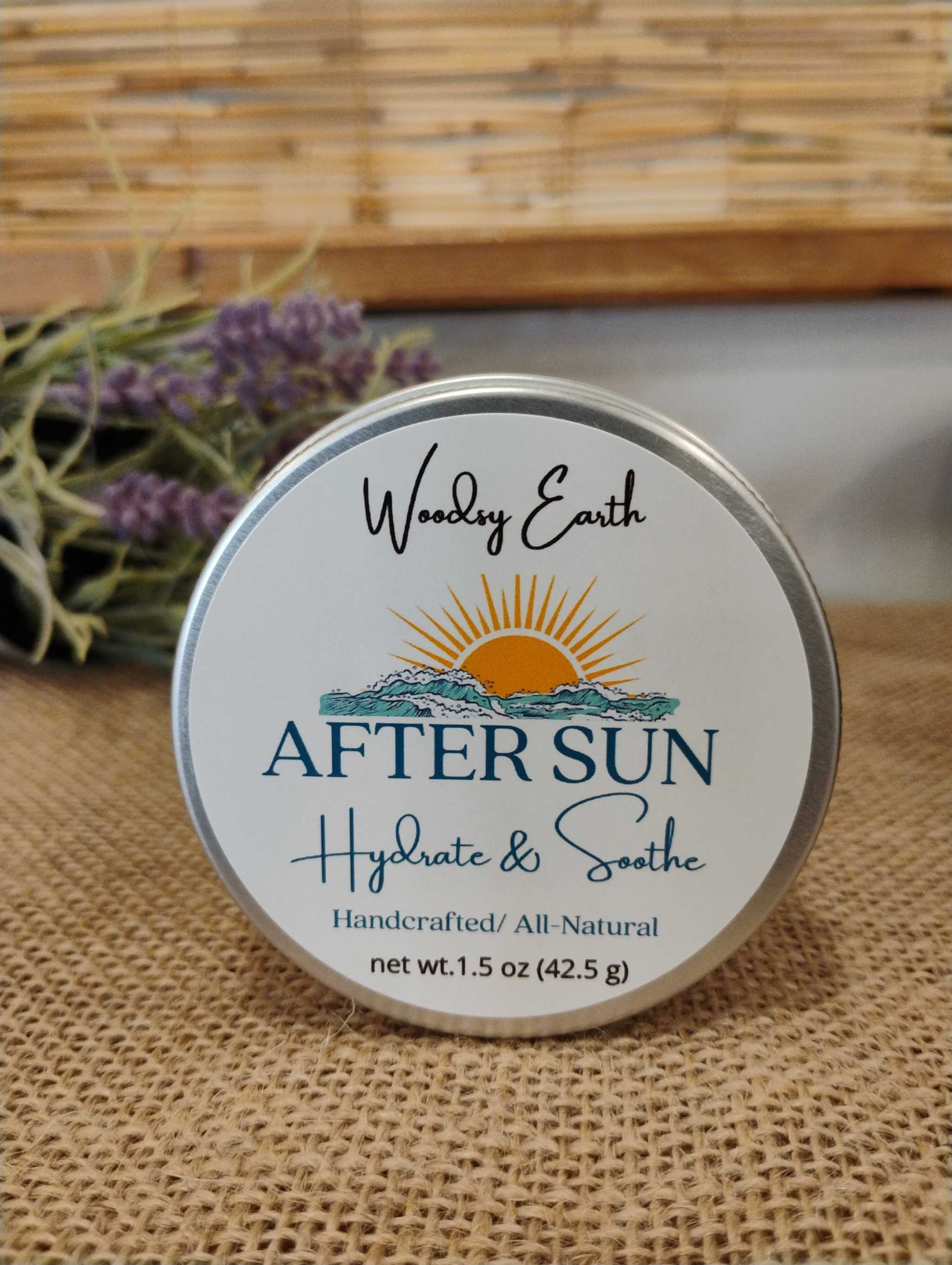 Woodsy Earth After Sun Lotion Bar in metal tin with label, handcrafted with grass-fed tallow, calendula, comfrey, peppermint, and lavender to hydrate and soothe sun-exposed skin.