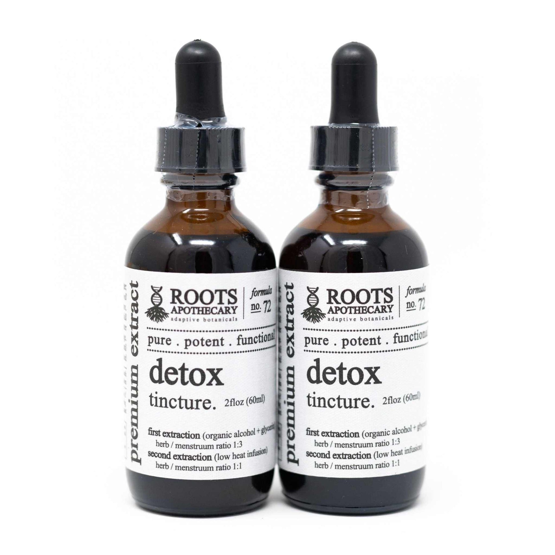 Two bottles of Roots Apothecary Detox Tincture 2oz herbal supplement on a white background