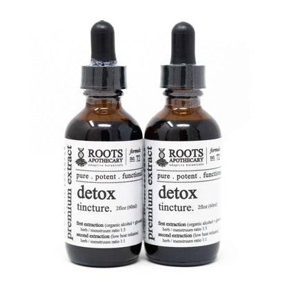Two bottles of Roots Apothecary Detox Tincture 2oz herbal supplement on a white background