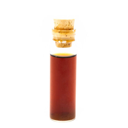 Roots Apothecary Energy Tincture sample in corked glass vial with herbal adaptogen blend for natural energy and focus