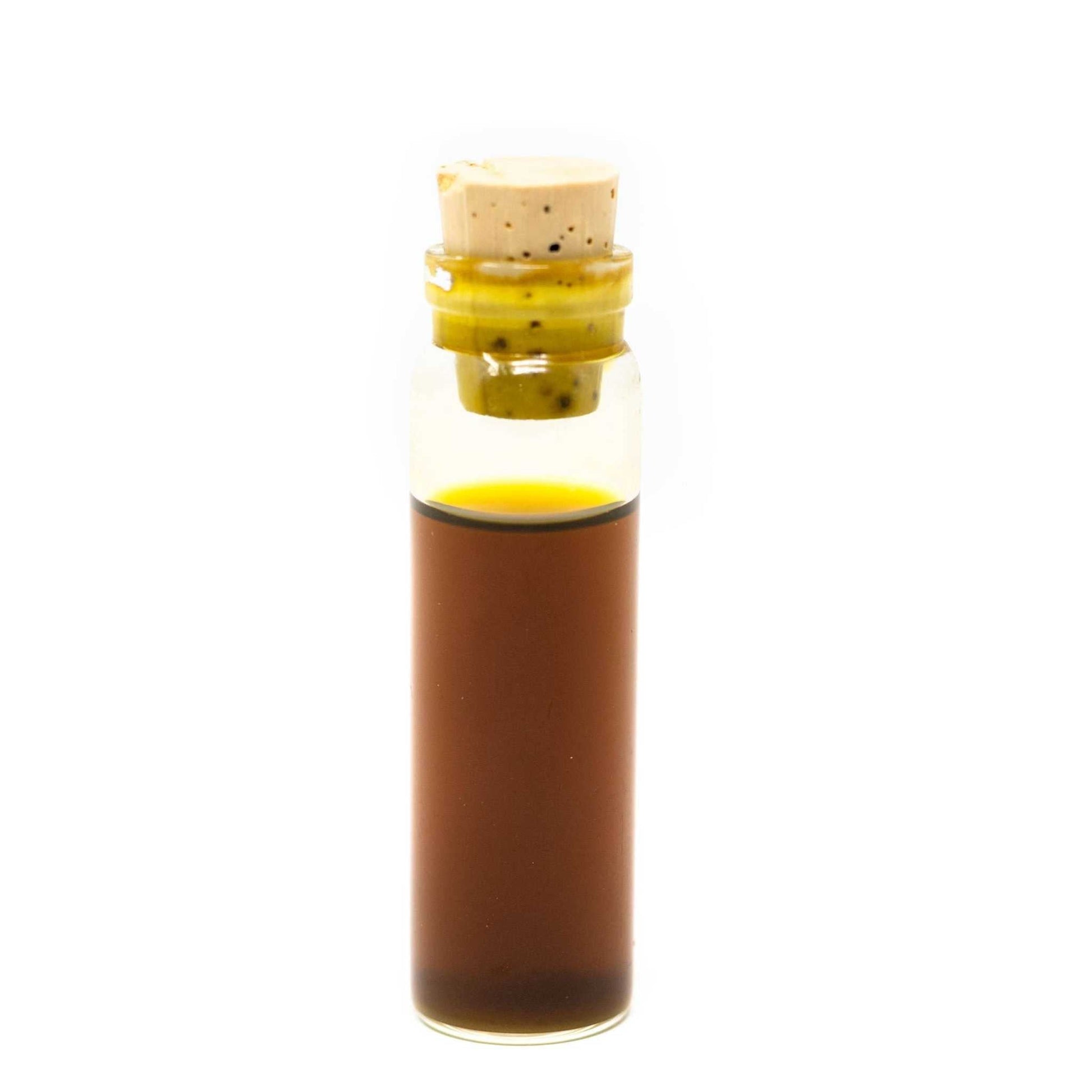 Roots Apothecary Inflammation Tincture sample vial with turmeric and organic botanical blend