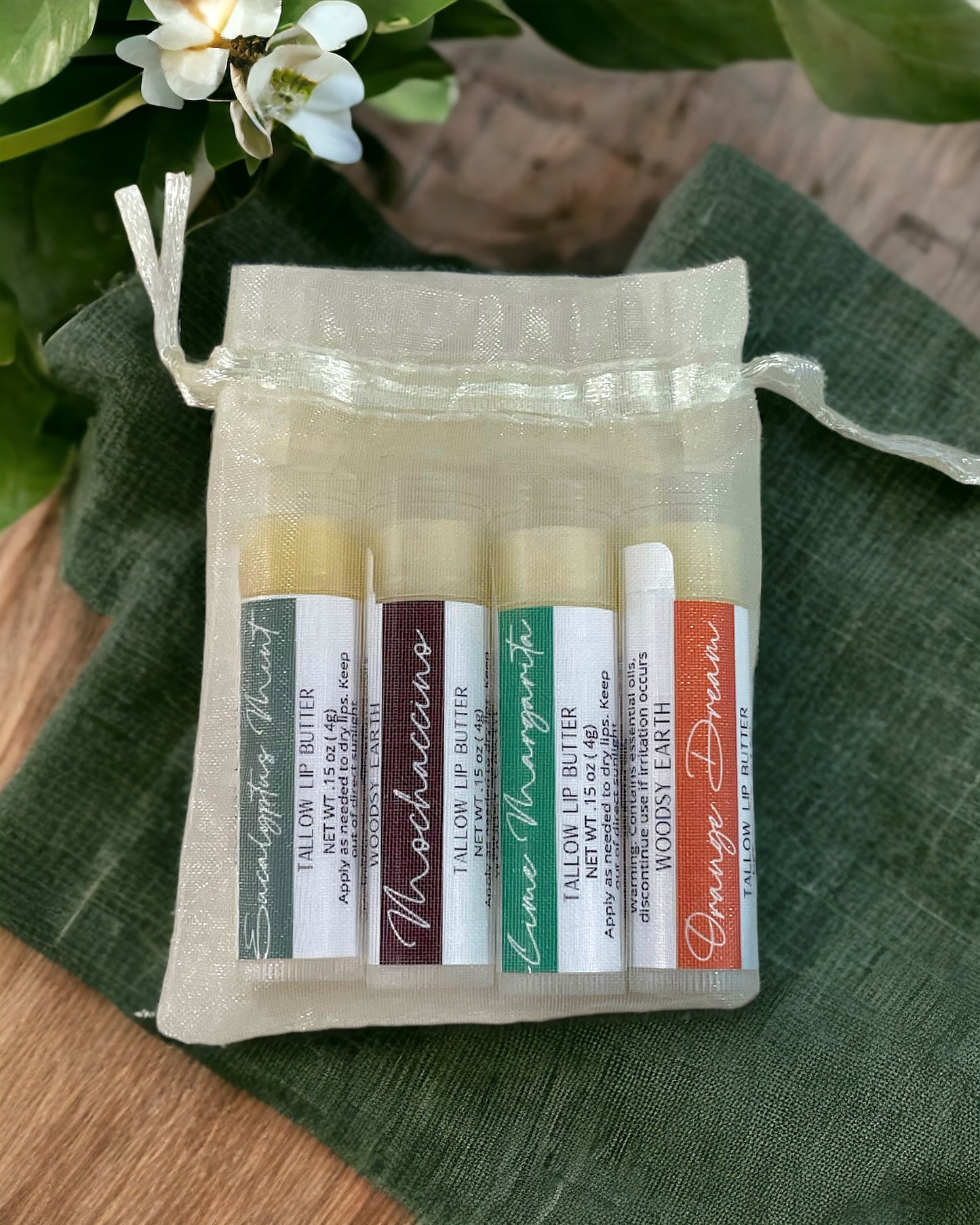 Tallow Lip Butter Variety Pack in organza bag with five different flavored tubes.