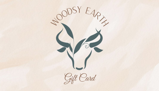 Woodsy Earth gift card front with cow logo and natural design background