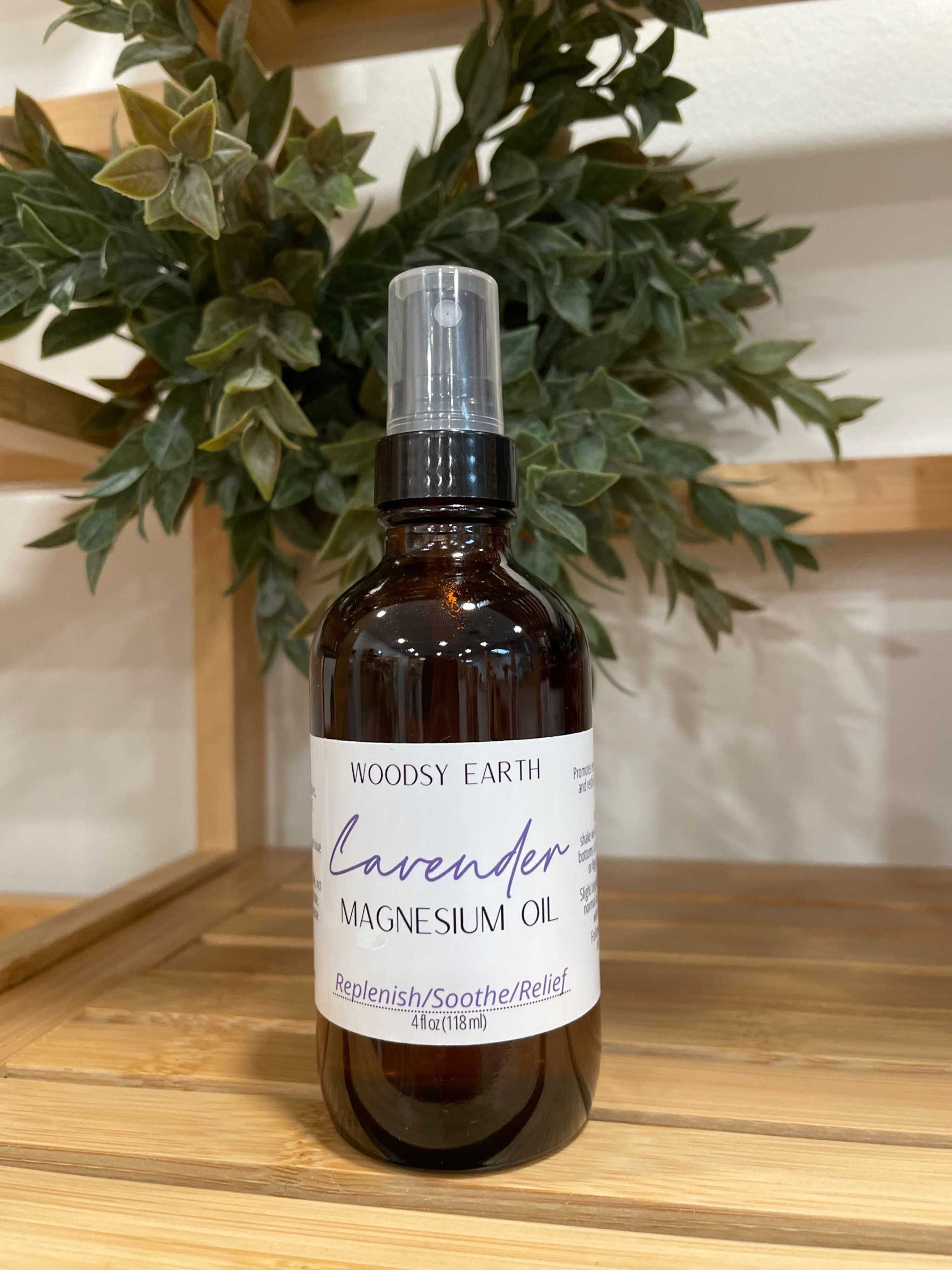 Woodsy Earth Lavender Magnesium Oil Spray in amber glass bottle, 4 oz size, for relaxation, sore muscles, and stress relief
