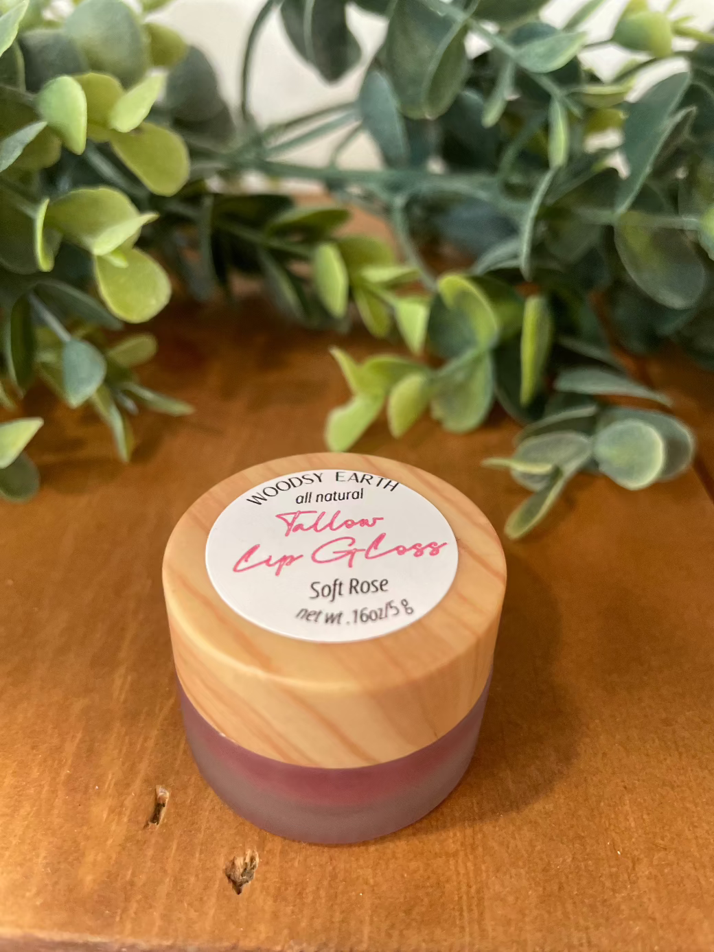 Woodsy Earth Soft Rose Tinted Tallow Lip Gloss in frosted jar with wooden cap, natural moisture and subtle color.