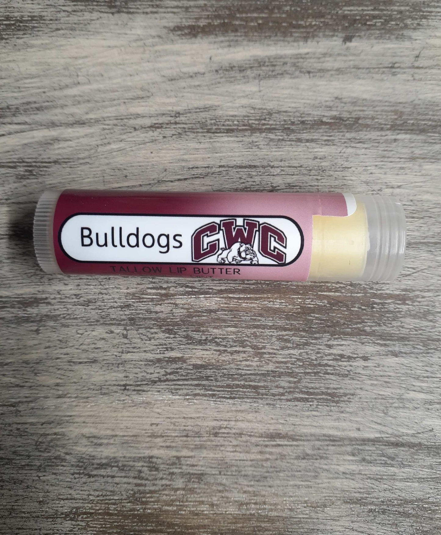 Customizable Bulldogs lip butter stick with vanilla mint scent.