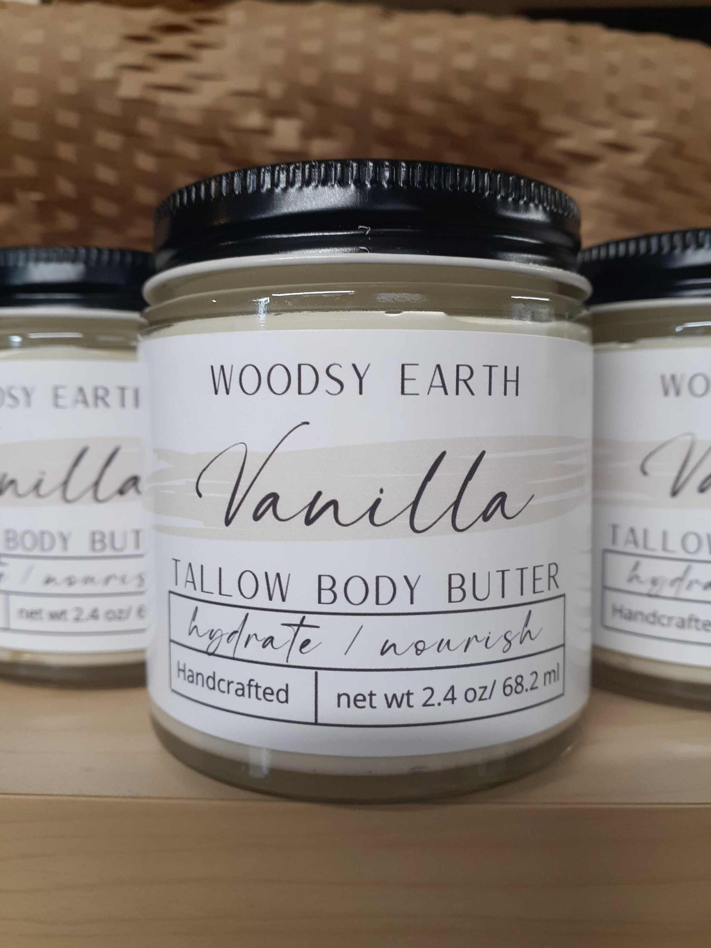 Vanilla Body Butter in 4 oz glass jar with screw top lid, enriched with organic oils and tallow for long-lasting moisture.