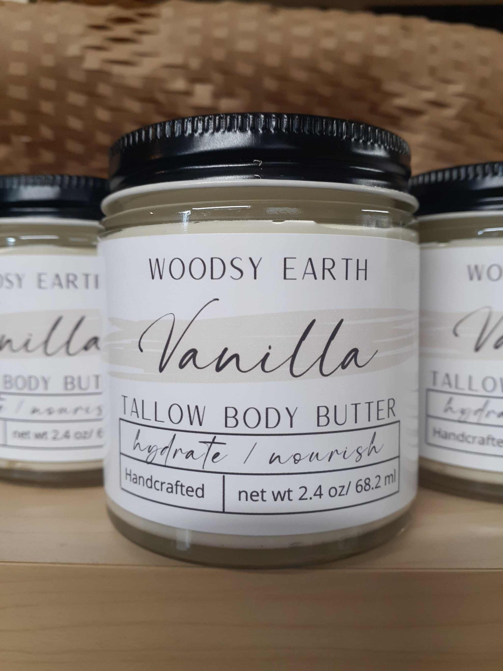 Vanilla Body Butter in 4 oz glass jar with screw top lid, enriched with organic oils and tallow for long-lasting moisture.