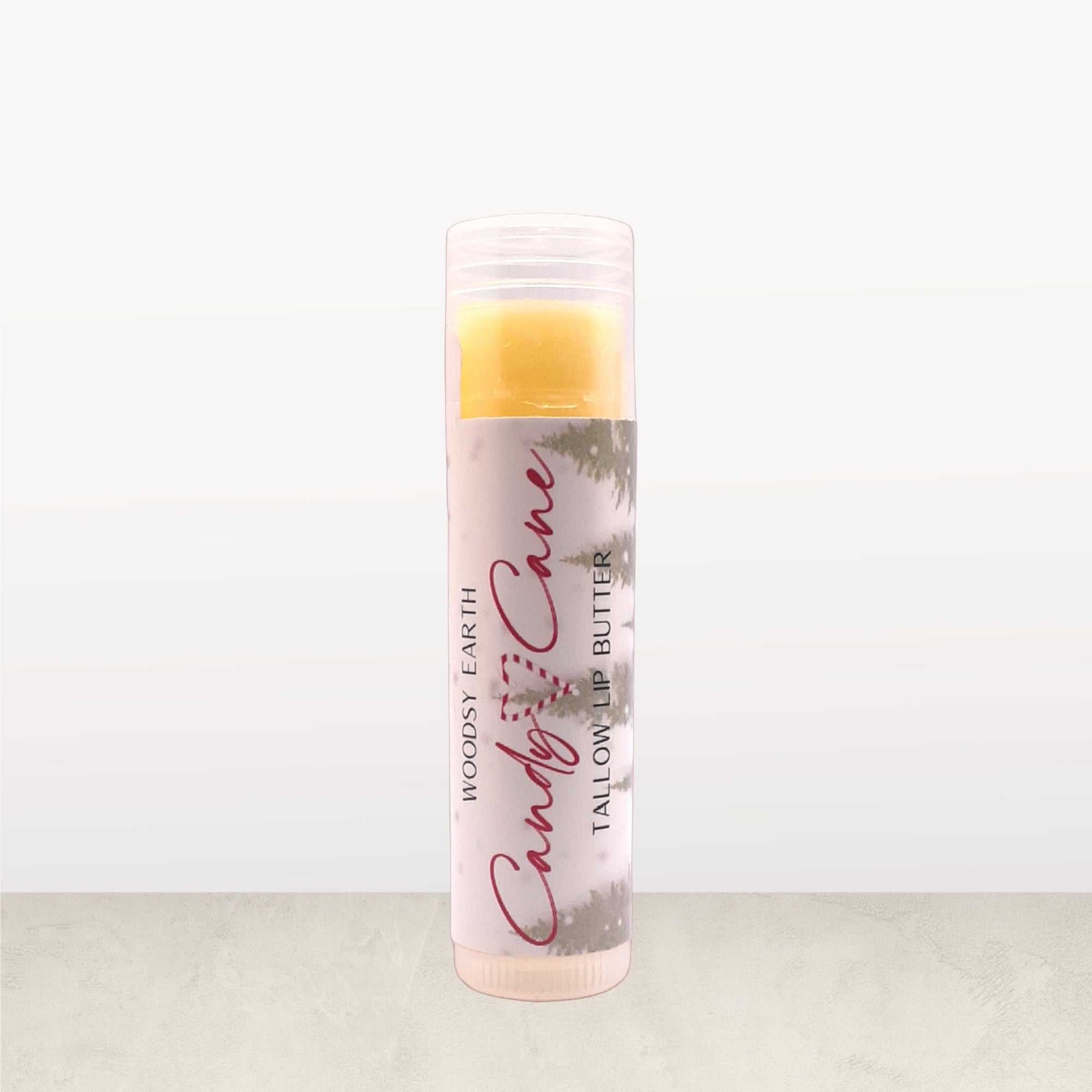 Candy Cane Tallow Lip Butter in clear tube, made with peppermint, spearmint, and vanilla oils for a festive holiday lip balm.