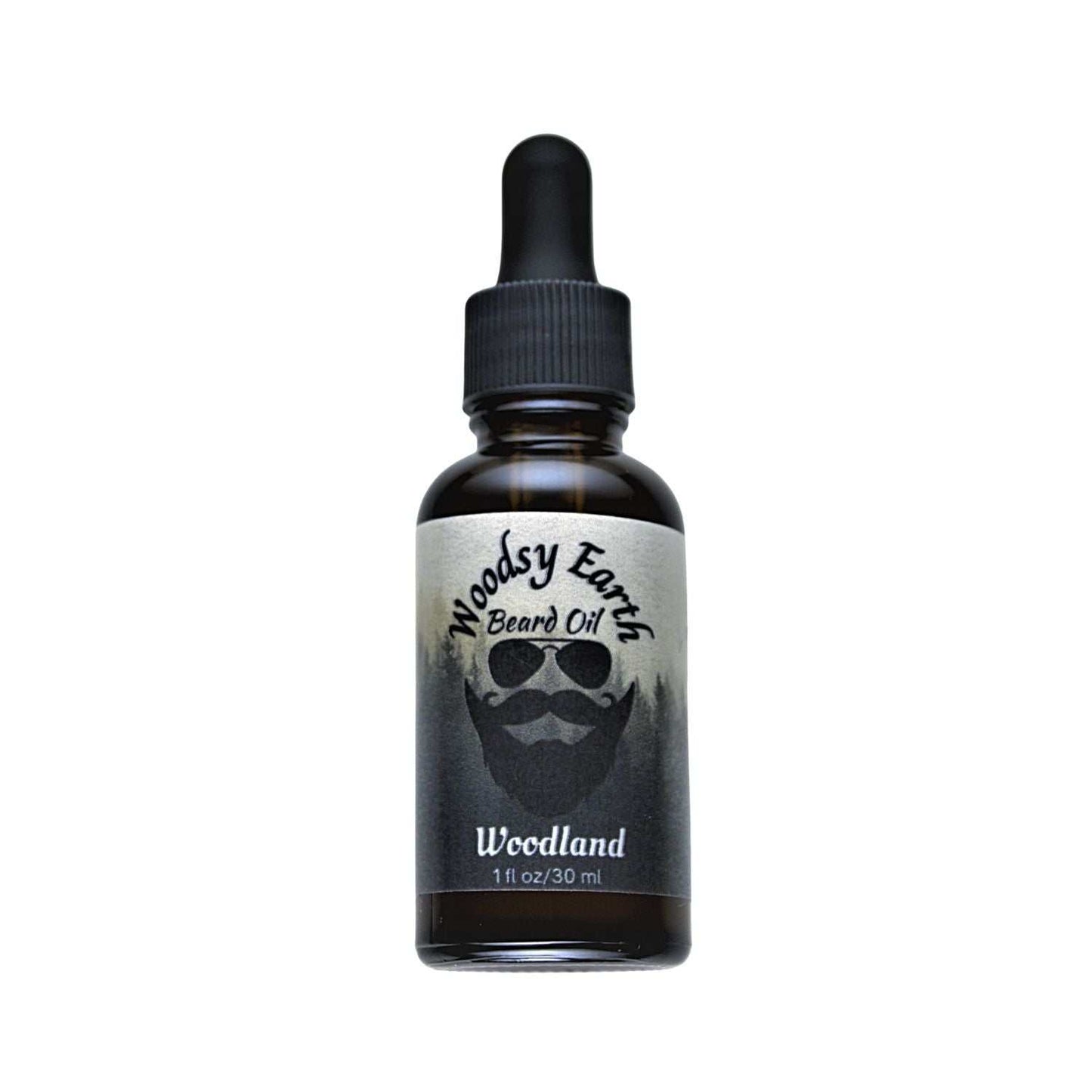 Woodsy Earth Woodland Beard Oil in amber glass dropper bottle, made with cedarwood, vetiver, and vanilla to moisturize and soften beards