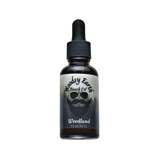 Woodsy Earth Woodland Beard Oil in amber glass dropper bottle, made with cedarwood, vetiver, and vanilla to moisturize and soften beards